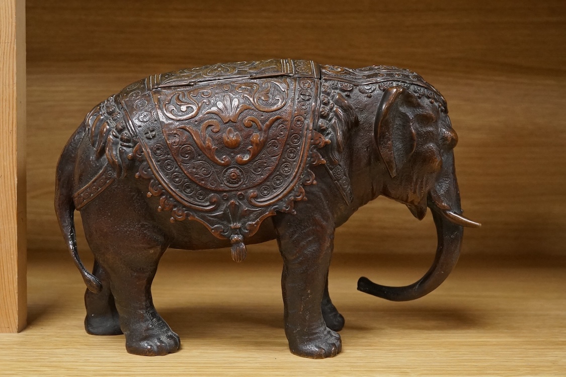A novelty late 19th/early 20th century bronze inkwell in the form of an Indian elephant, 27cm wide